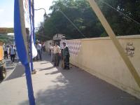 CNN crew and campaign advertisment on polling station enterance